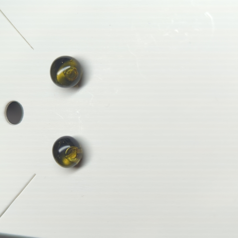 Artisan Handmade translucent  transparent grey glass gold studs. .5cm in size.